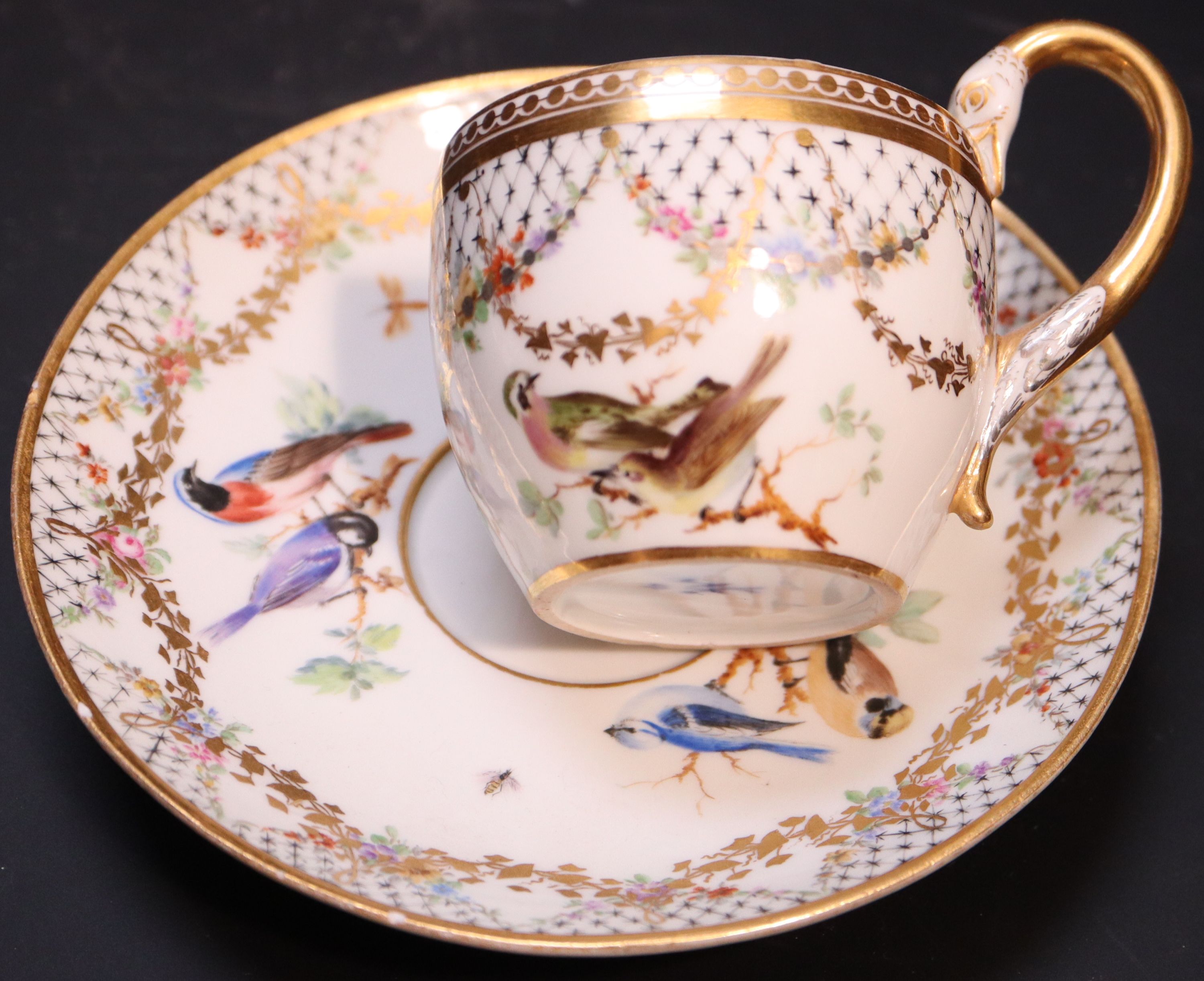 Five Continental porcelain cups and saucers, 19th century,